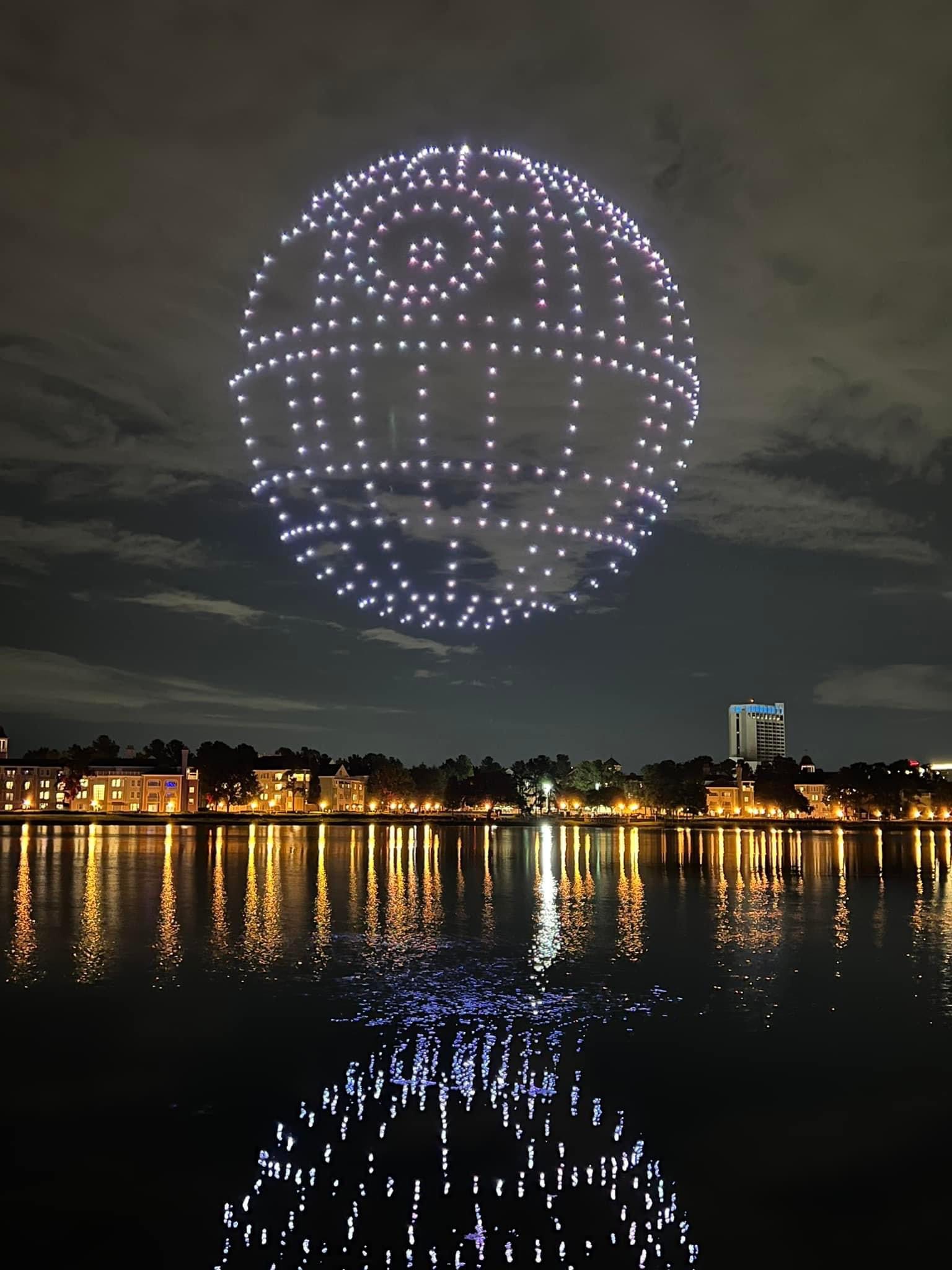 Disney Springs drone show reflected over the water